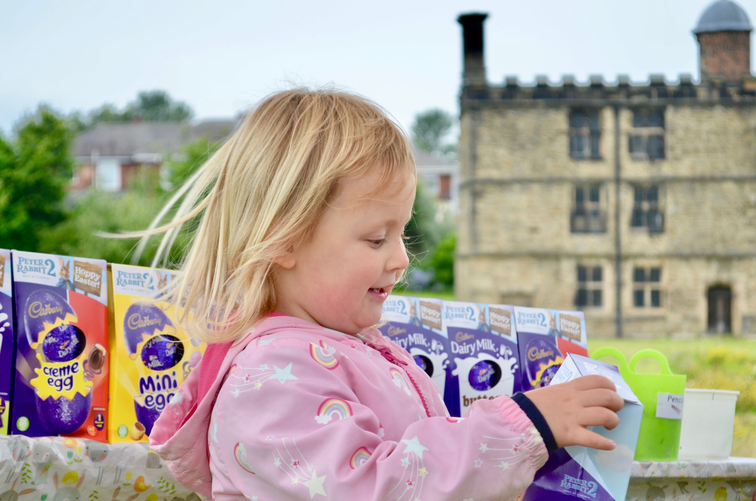 Child enjoying Easter egg hunt activities in Sheffield Manor Lodge’s historic ruins.