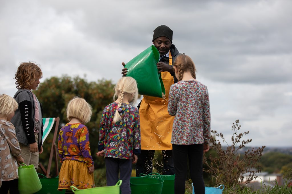 Visitor enjoying the Wheat Threshing day (2022) at The Green Estate in partnership with The Sheffield Wheat Experiment.

Image © Andy Brown / Sheffield Wheat Experiment